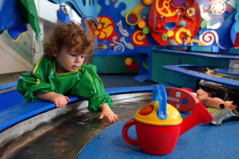 theo at brooklyn childrens museum playing with water